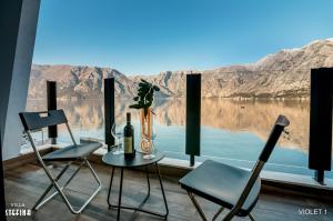 a room with two chairs and a table with a view at Villa Stefina in Kotor