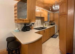 A kitchen or kitchenette at Lake Archambault Waterfront SPA Billiard Ski Games