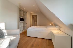 Postel nebo postele na pokoji v ubytování Kapitänshaus Ost