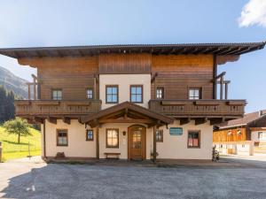 a large wooden building with a roof at Chalet in Mittersill near Ski Slopes in Mittersill