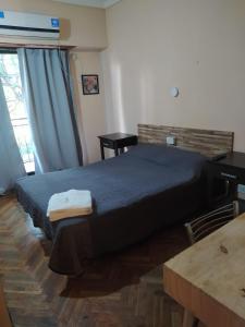 Ένα ή περισσότερα κρεβάτια σε δωμάτιο στο Hotel Manzanares Plaza