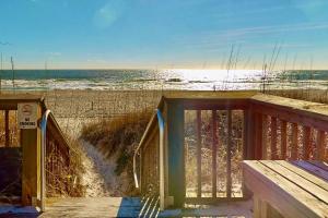an open door to a beach with the ocean at Casa Al Mare in Carolina Beach