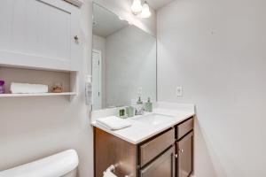 a bathroom with a sink and a mirror at Union City Townhome 17 Mi to Downtown Atlanta! in Union City +17 photos