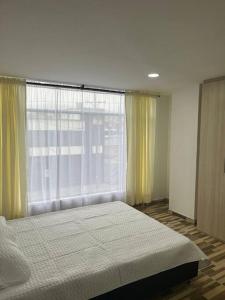 Ένα ή περισσότερα κρεβάτια σε δωμάτιο στο Exclusivo Apartamento amoblado