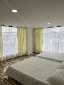 Ένα ή περισσότερα κρεβάτια σε δωμάτιο στο Exclusivo Apartamento amoblado +2 φωτογραφίες