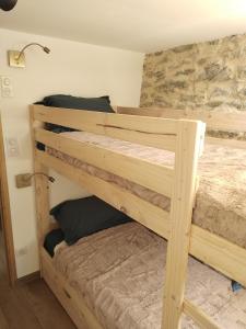 a couple of bunk beds in a room at U MULINU in Moïta