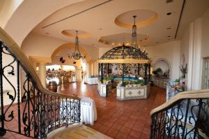 a large lobby with a room with a pool at Grand Isla Navidad Golf & Spa Resort with Marina in Barra de Navidad