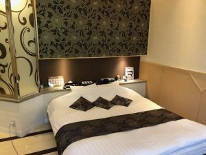 Postel nebo postele na pokoji v ubytování HOTEL Sweets