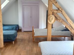 a room with two bunk beds and a ladder at Charmante Longère avec Terrasse et Piscine Chauffée, proche châteaux et zoo, en pleine nature - FR-1-591-240 in Saint-Lactencin +19 photos