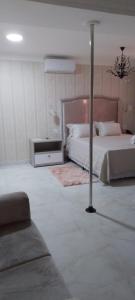 Hotel Tauari客房内的一张或多张床位