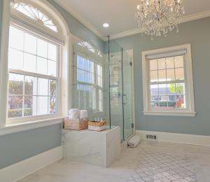a bathroom with a shower and a chandelier at Wood Manor Guest House in Tuscaloosa +69 photos