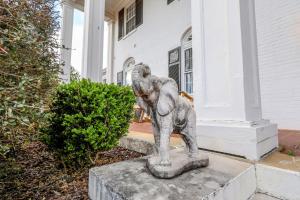 a statue of an elephant standing in front of a house at Wood Manor Guest House in Tuscaloosa