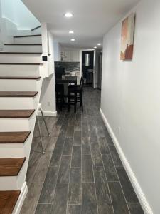 a kitchen and dining room with a tile floor at Modern & cozy Room in Queens near Train station and buses in Woodhaven