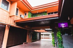 an entrance to a building with plants growing on it at Hotel Ava Gil Puyat in Manila +18 photos