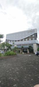 a building with a lot of solar panels on it at Grand Kolopaking Hotel in Kebumen
