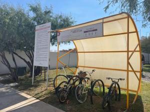two bikes are parked next to a sign at Espaciosa casa cerca de zona industrial in San Luis Potosí