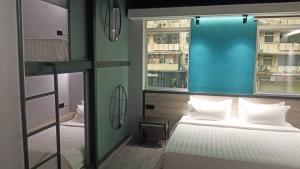 Postel nebo postele na pokoji v ubytování Pantai Inn Kota Kinabalu