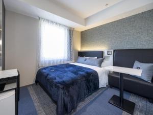 Postel nebo postele na pokoji v ubytování Green Rich Hotel Tokuyama Ekimae