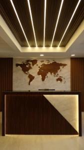 a world map on the wall of a room at Vrishi Inn in Bangalore