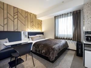 Postel nebo postele na pokoji v ubytování Green Rich Hotel Tokuyama Ekimae