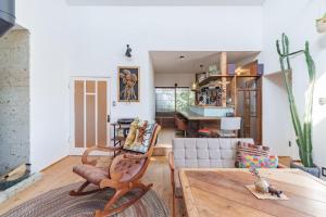 a living room with a table and a dining room at SMALL TOWN HOTEL Hakodate in Hakodate