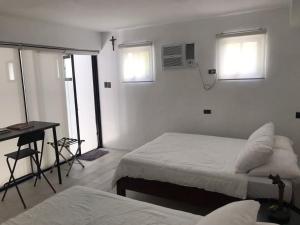 Postel nebo postele na pokoji v ubytování Paradores Filipinas