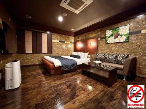 a hotel room with a bed and a couch at Hotel Asian Color (Adult Only) in Tokyo +19 photos