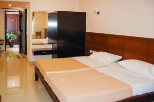 Postel nebo postele na pokoji v ubytování Philomena Hotel & Apartment