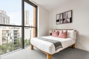 Krevet ili kreveti u jedinici u objektu Urban Rest Parramatta Apartments