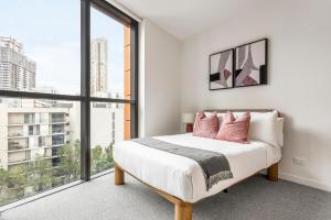 Ένα ή περισσότερα κρεβάτια σε δωμάτιο στο Urban Rest Parramatta Apartments