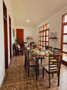 a dining room with a table and chairs at Miski Rumi. in Huaycán Alto