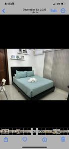 a picture of a bedroom with a bed in a room at La casa de Maria in Santo Domingo