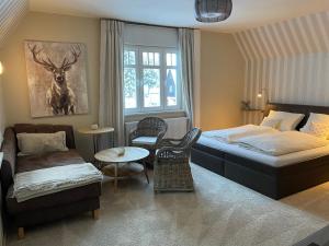 Giường trong phòng chung tại Villa Marie Ferienwohnungen +51 ảnh