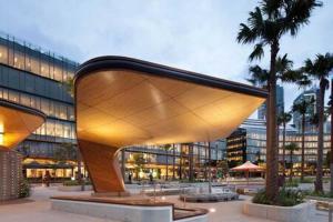 a large glass building with a large building at A Comfy Studio for 5 Next to Darling Harbour in Sydney