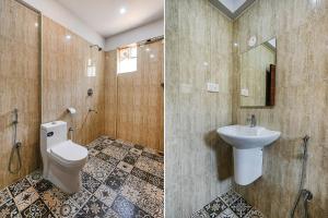a bathroom with a toilet and a sink at FabHotel Tree Suites in Bangalore