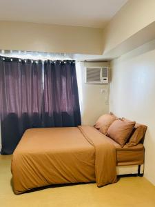 a bed in a room with a window and a bed sidx sidx at * * G Best value for the price! in Iloilo City
