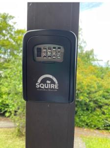 a pay phone is attached to a pole at High View in Swindon