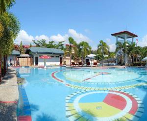a large swimming pool in a resort at Marand Family Resort in Bauang