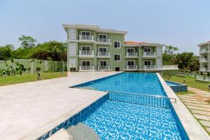 an image of a villa with a swimming pool at B&F Meadows - Your Premier Apartment Hotel in Revora