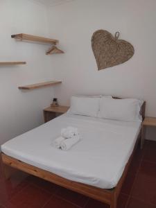 Ένα ή περισσότερα κρεβάτια σε δωμάτιο στο Masayana