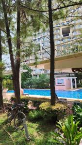 The swimming pool at or close to 1608 Three Bedrooms With 1 free parking, swimming pool WiFi and Netflix at Northpoint Camella Condominium Bajada Davao City