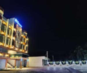 a building at night with the lights on at Hotel Riverfront , Prabhas Patan in Somnath