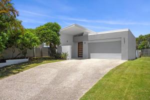 a rendering of a house with a garage at Mermaid Waters House in Gold Coast