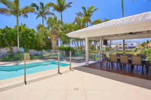 a patio with a gazebo and a swimming pool at Mermaid Waters House in Gold Coast