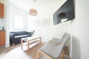 TV a/nebo společenská místnost v ubytování Casa O Carteiro en Cedeira