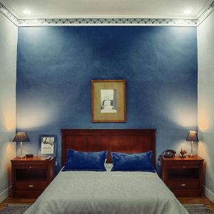 Кровать или кровати в номере Casa 1881