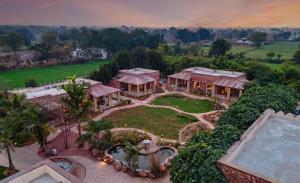 an aerial view of a house with a swimming pool at Aranya Vilas, Ranthambhore in Khilchipur