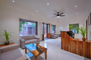 a living room with a couch and a table at Aranya Vilas, Ranthambhore in Khilchipur