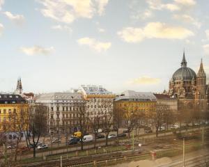 a view of a city with buildings and cars at Modern Vienna Apartment in Prime Location in Vienna