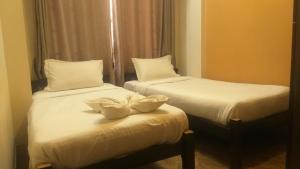 Postel nebo postele na pokoji v ubytování Paradise Guest House